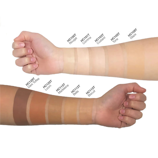 VOUGEA Luxe Concealing Cream with doe-foot applicator and creamy texture swatched on blush pink background