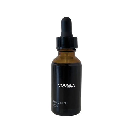 VOUGEA Luxe Rosehip Anti-Aging Serum in glass dropper bottle with rose petals on blush pink background
