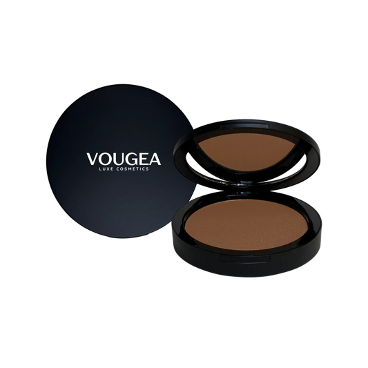 VOUGEA Luxe Bronzer compact with silky matte powder in warm red-brown tones displayed on soft rose gold background