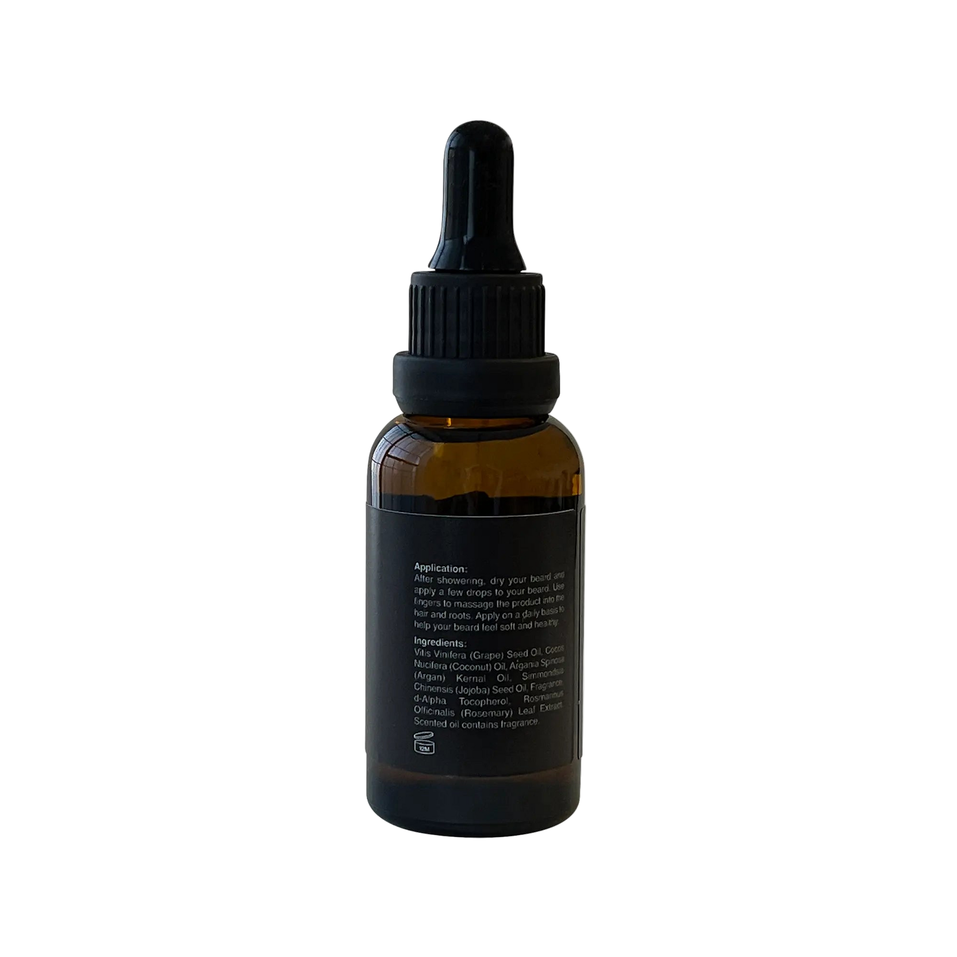 VOUGEA Luxe Premium Beard Oil in amber glass dropper bottle with rosemary sprigs and argan seeds on natural wood background