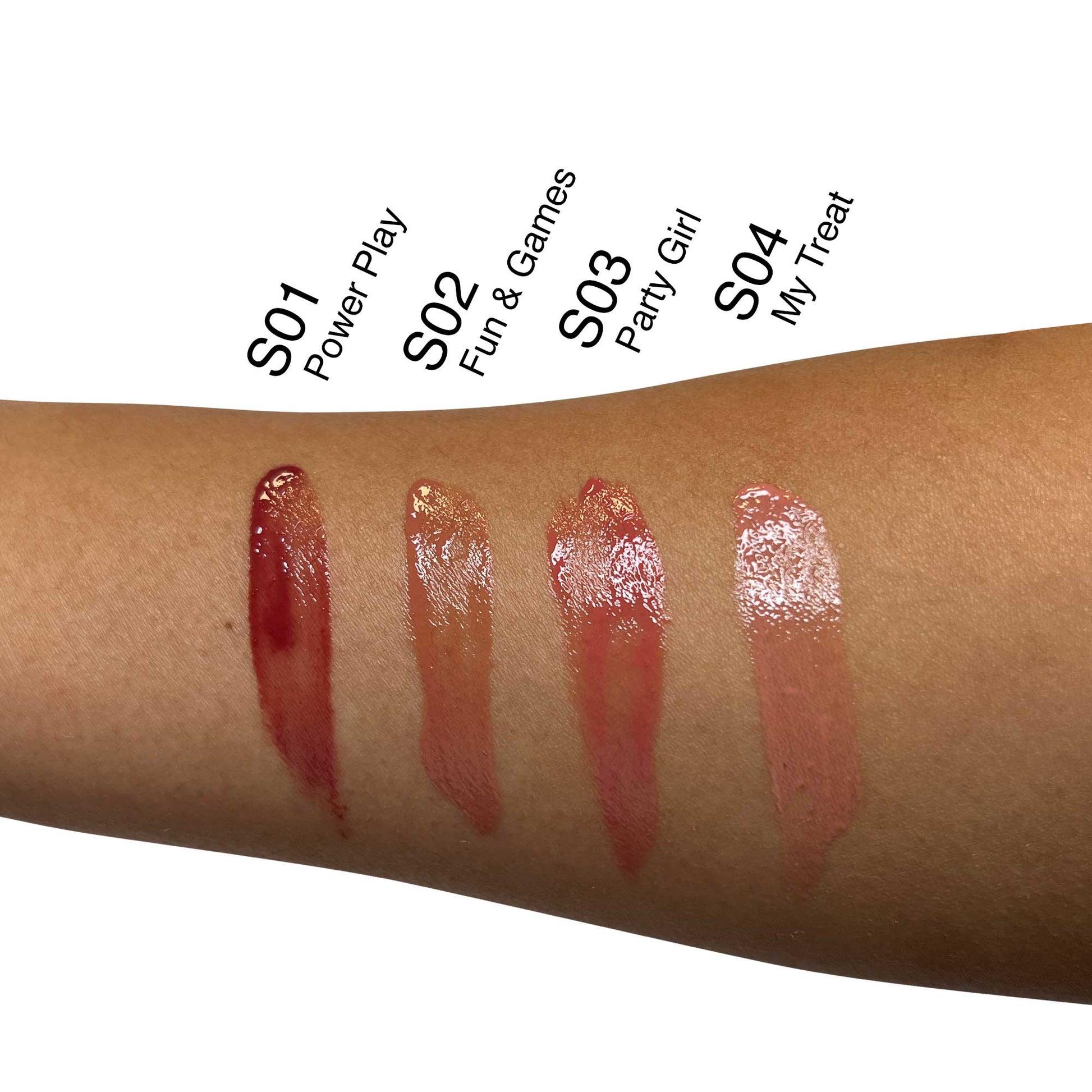VOUGEA Luxe Hydrating Lip Oil in sleek rose gold tube with shimmering finish on blush pink background