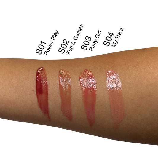VOUGEA Luxe Hydrating Lip Oil in sleek rose gold tube with shimmering finish on blush pink background
